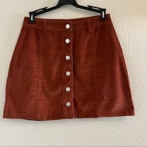 BUTTON THROUGH CORD MINI
SKIRT